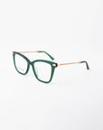 A pair of green Paris Two eyeglasses with square-shaped frames and gold braided metal arms by For Art's Sake® is displayed against a plain white background. The brand name is visible on the left lens. Designed with both classic and modern elements in mind, these glasses also feature a blue light filter for added protection.