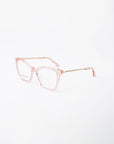 A pair of stylish eyeglasses with clear pink square frames and gold temple arms, featuring a textured design. With UV protection and a blue light filter, the Paris Two by For Art's Sake® are perfect for both fashion and function. The glasses are displayed on a white background.