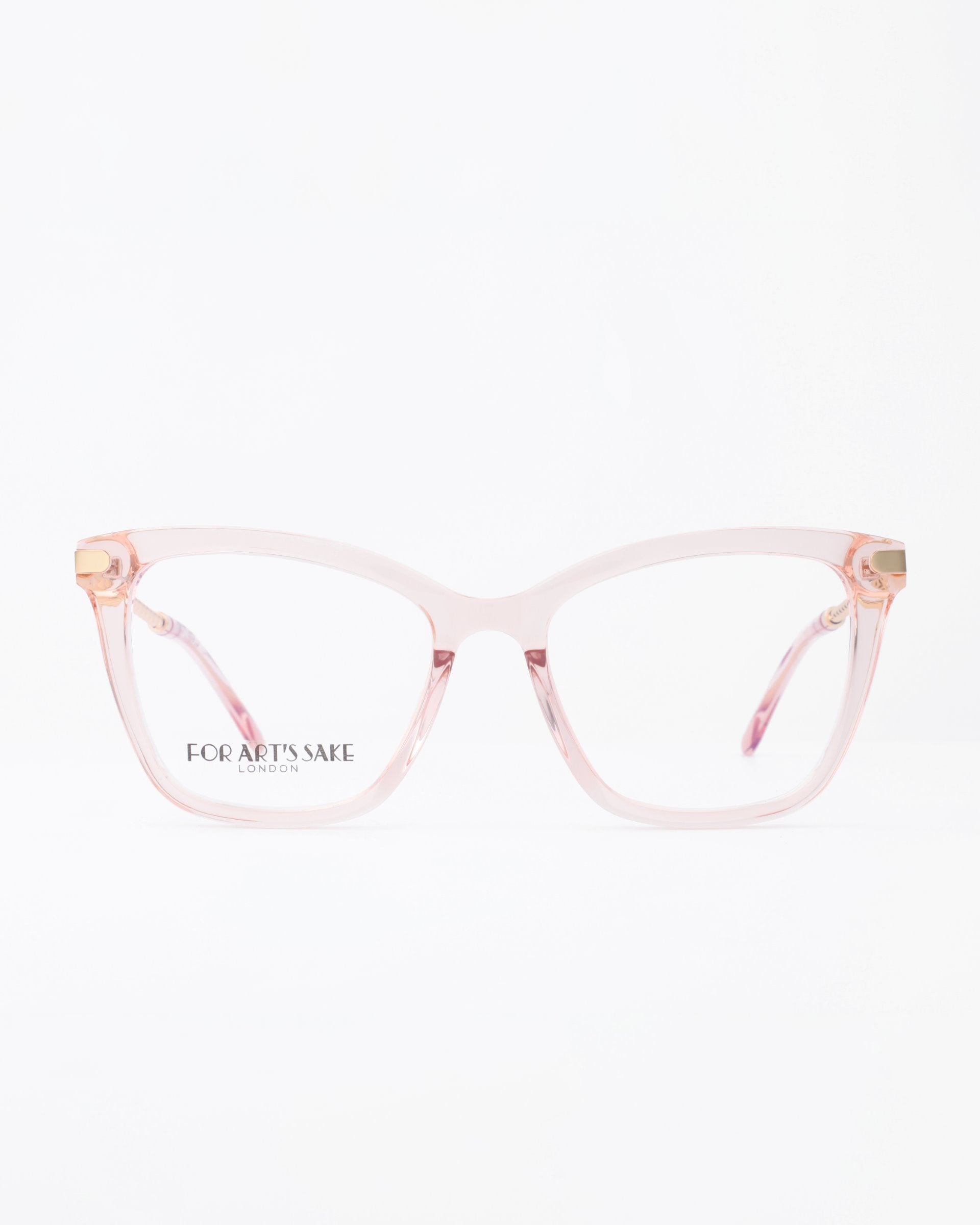 A pair of stylish, transparent pink eyeglasses with a slight cat-eye shape and gold accents on the hinges. The brand For Art's Sake® is printed on the left lens. Featuring blue light filter technology, they're perfect for modern lifestyles. The plain white background highlights the Paris Two eyeglasses beautifully.
