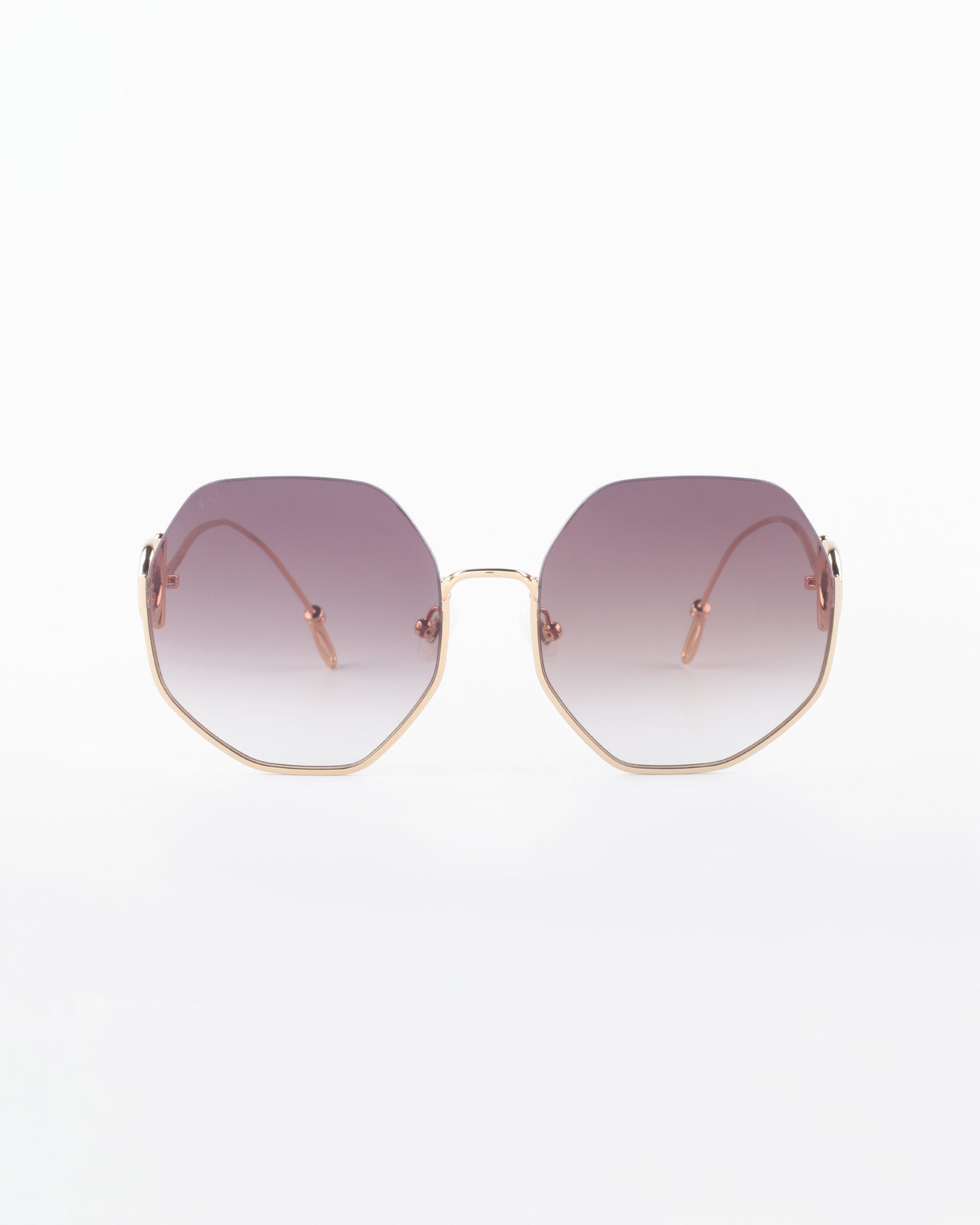 The For Art's Sake® Palace is a pair of sunglasses with geometric, octagonal-shaped lenses. The lenses are gradient, fading from dark purple at the top to lighter hues at the bottom. Featuring thin, gold-colored frames and arms, they are also UVA & UVB-protected for optimal eye safety.