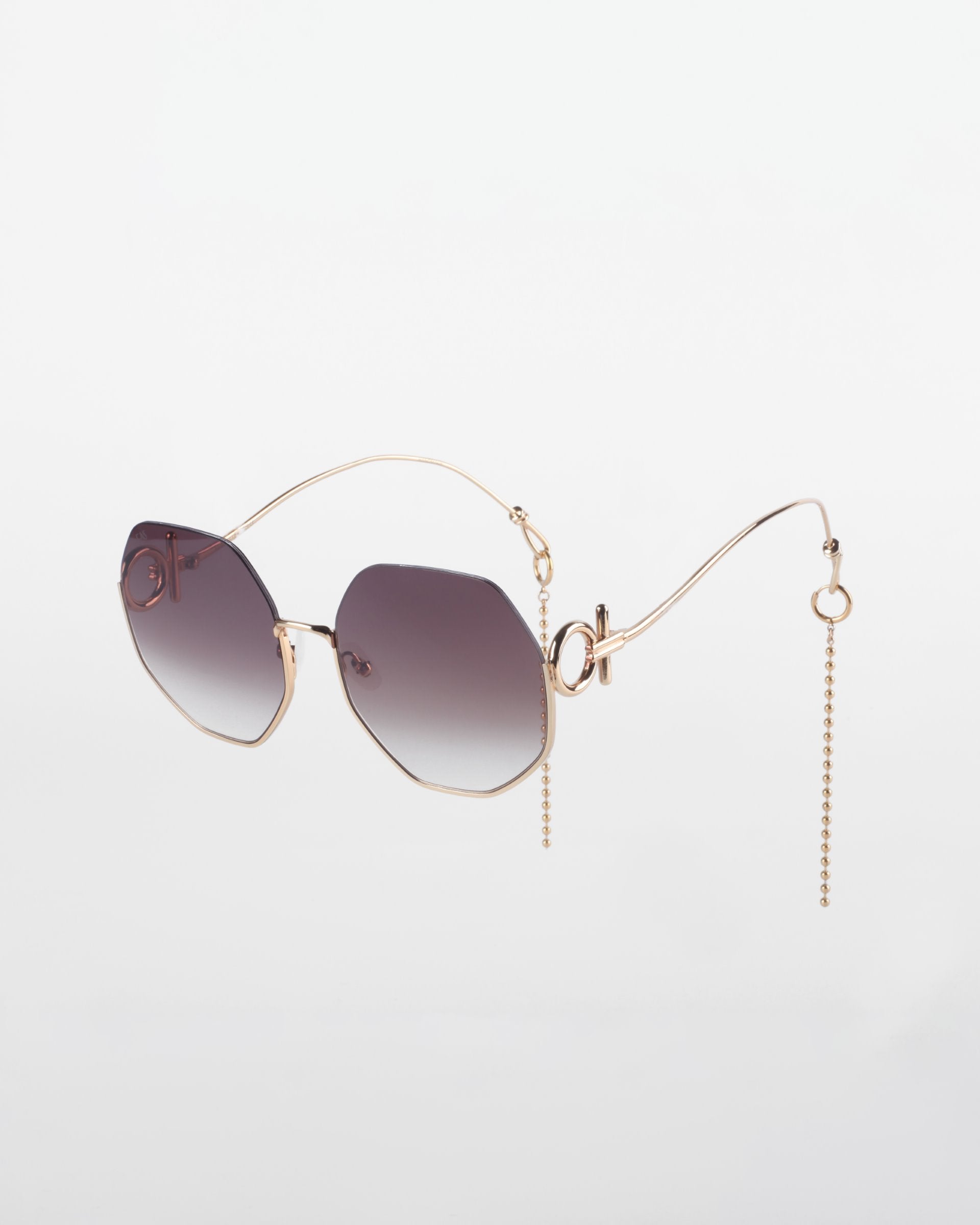 A pair of stylish, oversized Palace sunglasses with gradient lenses and unique, 18-karat gold-plated thin frames by For Art&#39;s Sake®. The temples have an elegant, curved design, with a chain dangling from the end of each temple. This Limited Edition accessory offers a chic and sophisticated look against a white background.
