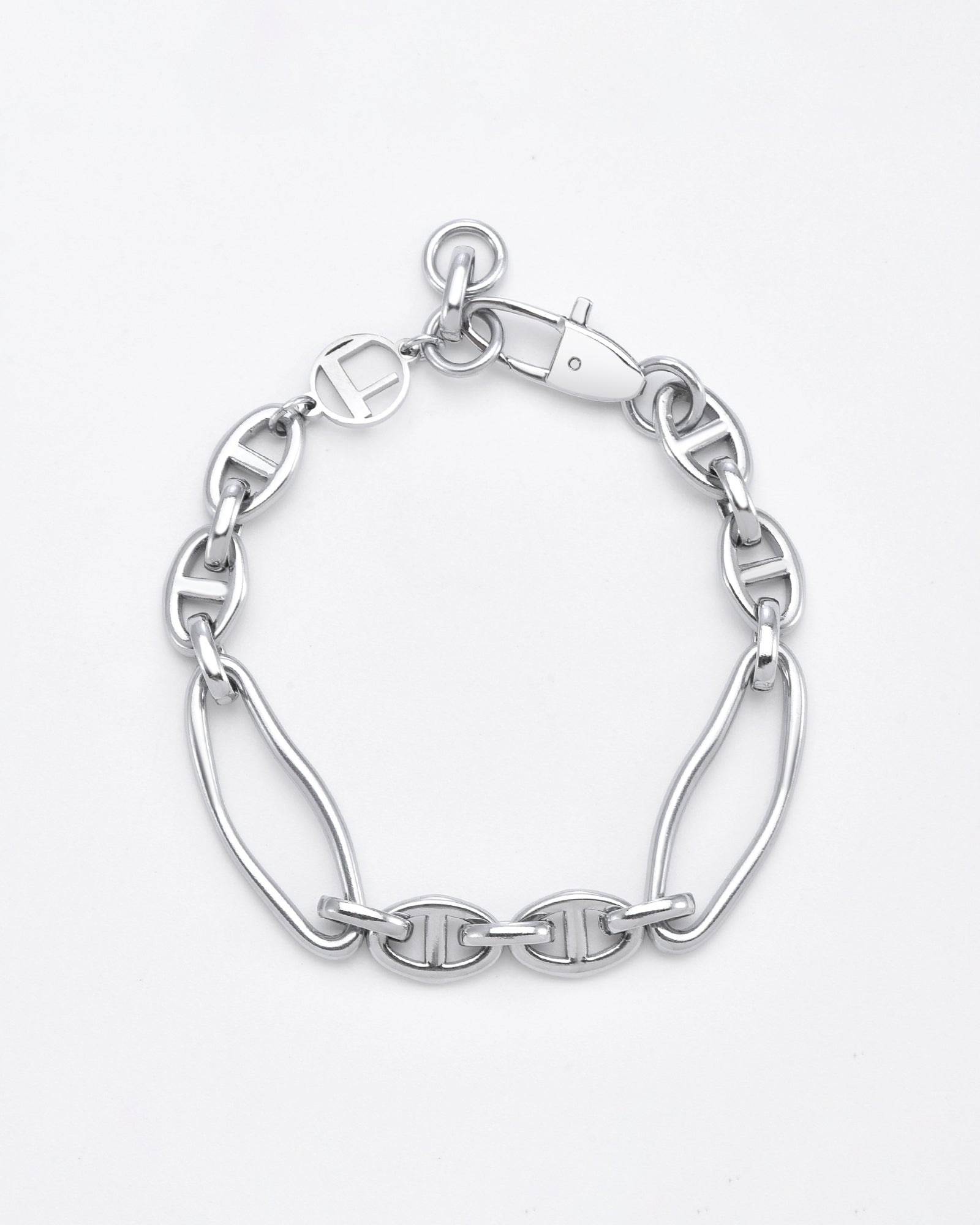 A stylish **Portrait Bracelet Silver** featuring a combination of large and small interlinked oval-shaped chain links. This hypoallergenic piece by **For Art's Sake®** boasts a lobster clasp with a circular charm attached near the closure, all set against a plain white background.