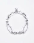 A stylish **Portrait Bracelet Silver** featuring a combination of large and small interlinked oval-shaped chain links. This hypoallergenic piece by **For Art's Sake®** boasts a lobster clasp with a circular charm attached near the closure, all set against a plain white background.