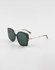 A pair of stylish, oversized square-shaped For Art's Sake® Fahrenheit sunglasses with dark green lenses and matching green frames. The temples feature 18-karat gold-plated chain detail connecting to the green earpieces, adding an elegant touch to the design. The handmade acetate sunglasses are displayed on a plain white background.