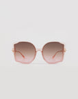 A pair of stylish, oversized frame sunglasses with pale pink handmade acetate frames and gradient lenses, transitioning from darker at the top to lighter at the bottom, set against a plain white background. These are the Fahrenheit by For Art's Sake®.