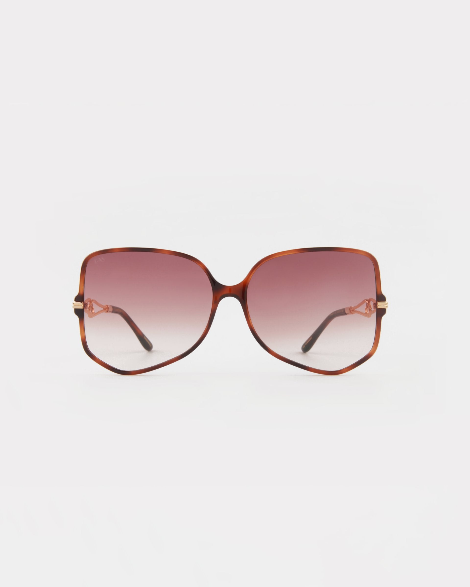 A pair of Voyager oversized square-shaped sunglasses from For Art&#39;s Sake® with brown-gradient lenses and tortoiseshell, gold-plated frames. The arms of the glasses are thin and match the frame color. Offering UVA &amp; UVB protection, this stylish eyewear is set against a plain white background.