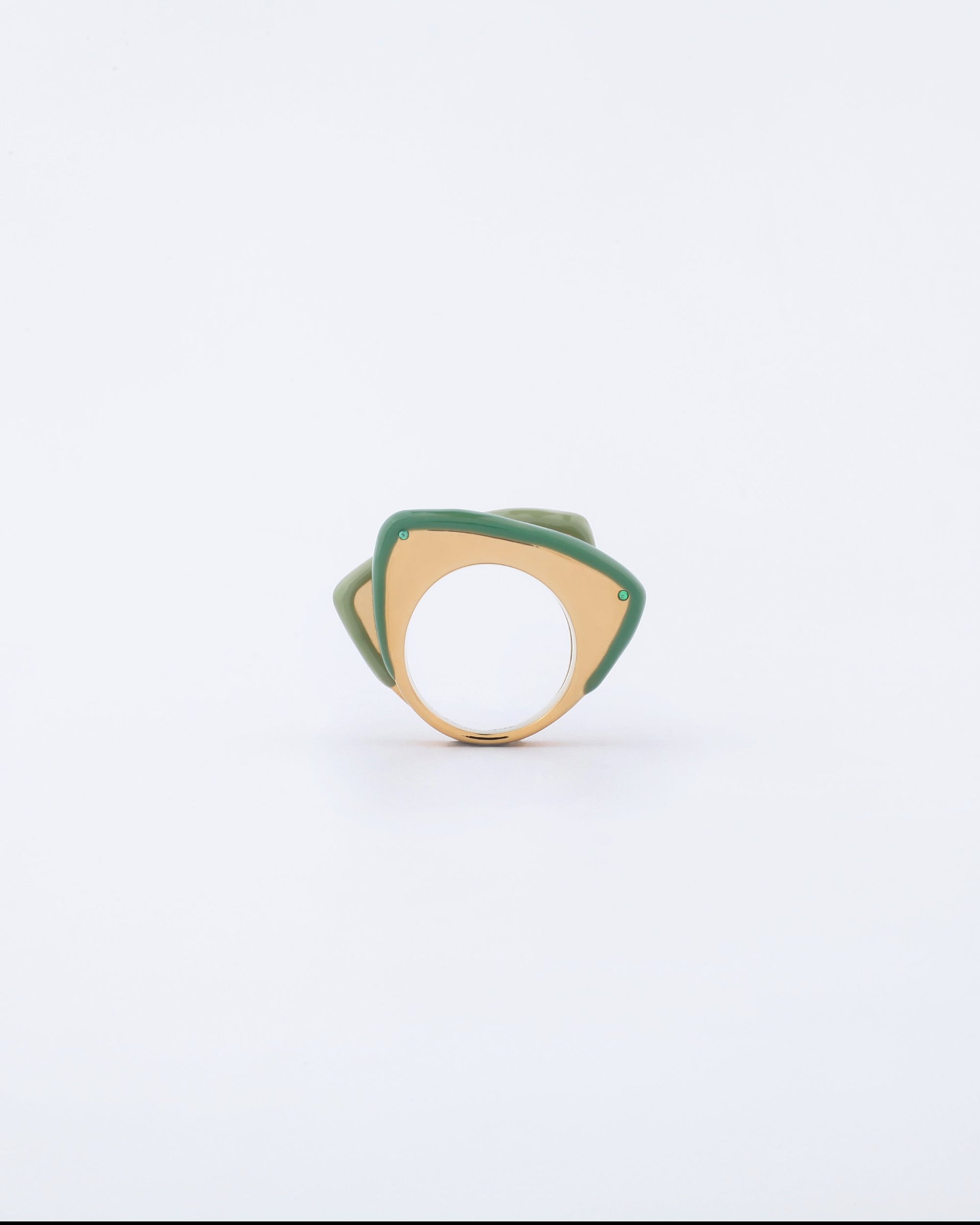 Introducing the Delta Ring by For Art's Sake®, featuring a yellow band adorned with an overlapping green design. The ring showcases a unique layered aesthetic with its wide, geometric shape and abstract form, giving it a modern, artistic look. Set against a plain white background, this ring presents a bold splash of color that stands out brilliantly.