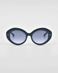 A pair of For Art's Sake® Helios sunglasses featuring an oversized, round design with tinted lenses is displayed against a plain white background, offering a touch of luxury eyewear.