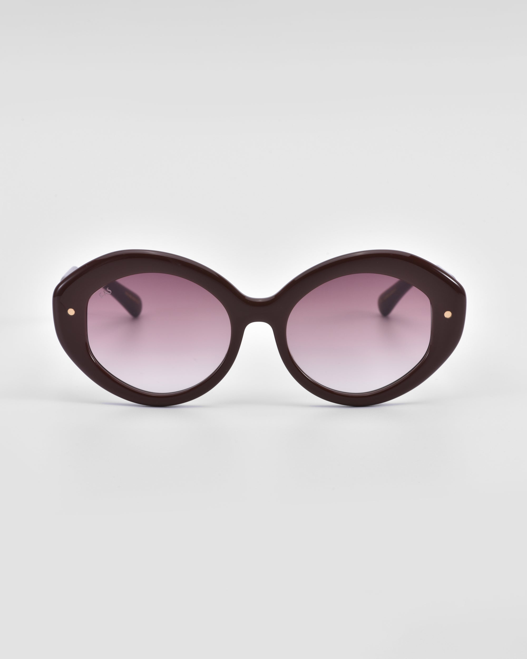 A pair of round, oversized Helios sunglasses with dark purple frames and gradient lenses transitioning from dark at the top to light at the bottom by For Art&#39;s Sake®. This piece of luxury eyewear is set against a plain white background.