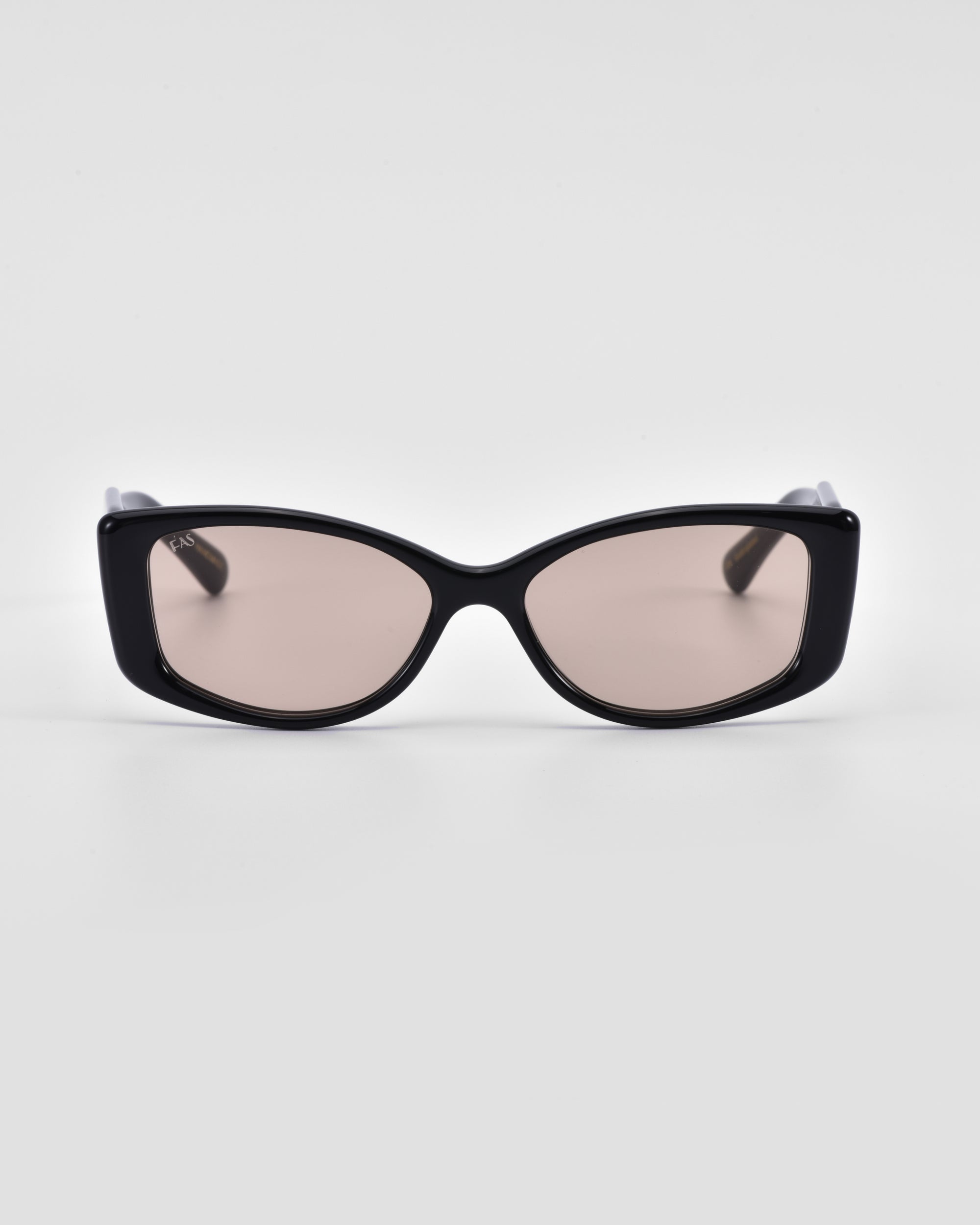 A pair of Mene sunglasses by For Art&#39;s Sake® with light brown tinted lenses set against a plain white background. The frames have a sleek, modern design, exuding an air of luxury.