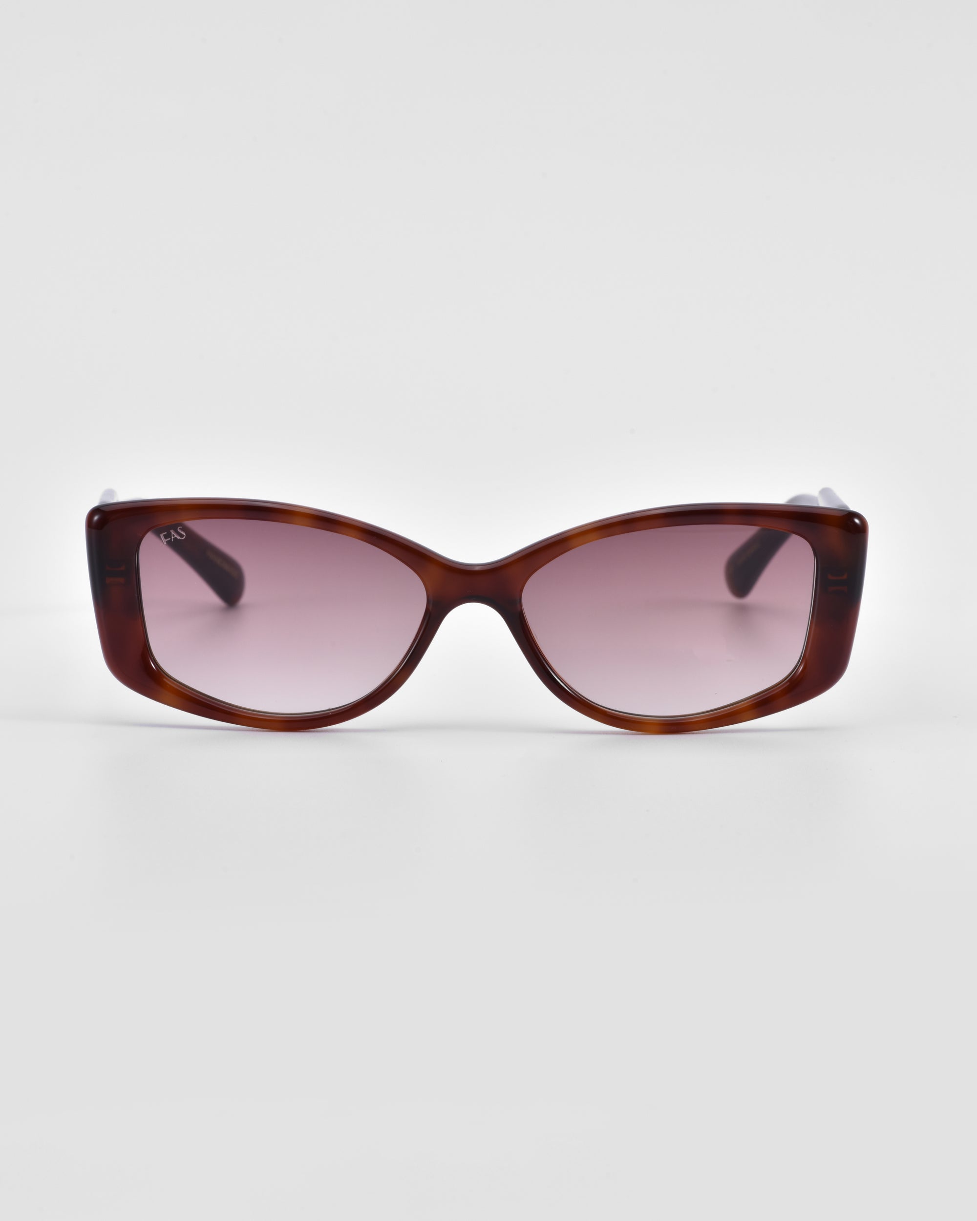A pair of Mene sunglasses by For Art&#39;s Sake® with a brown, glossy frame and rectangular lenses that have a subtle pinkish tint. The arms of the glasses are obscured but appear to match the frame in color. White background.