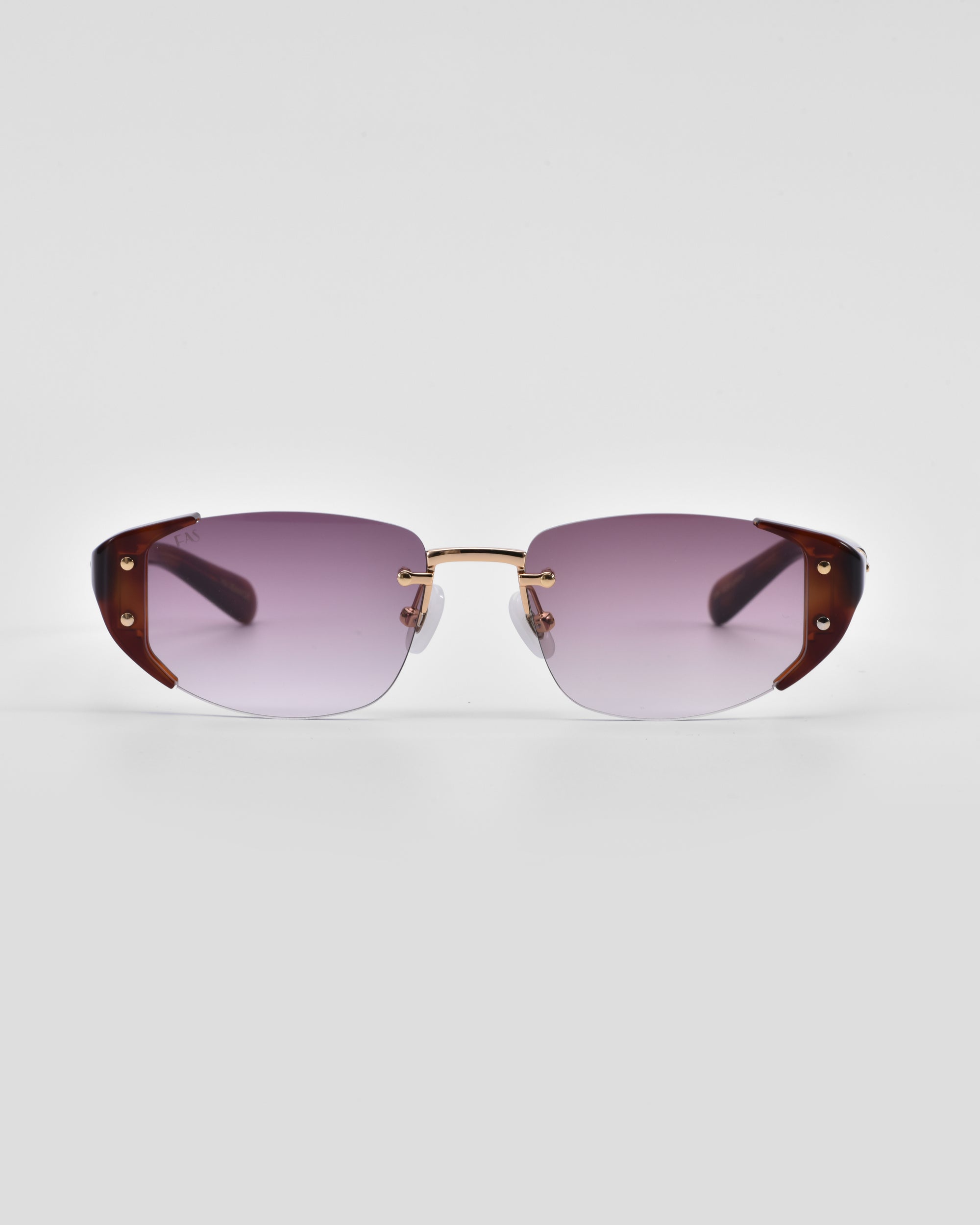 A pair of Harbour sunglasses with semi-rimless, rectangular, purple-tinted lenses by For Art&#39;s Sake®. Featuring brown, wide temples with metallic accents and a thin, 18 karat gold-plated bridge, the retro-inspired design stands out against a plain white background.