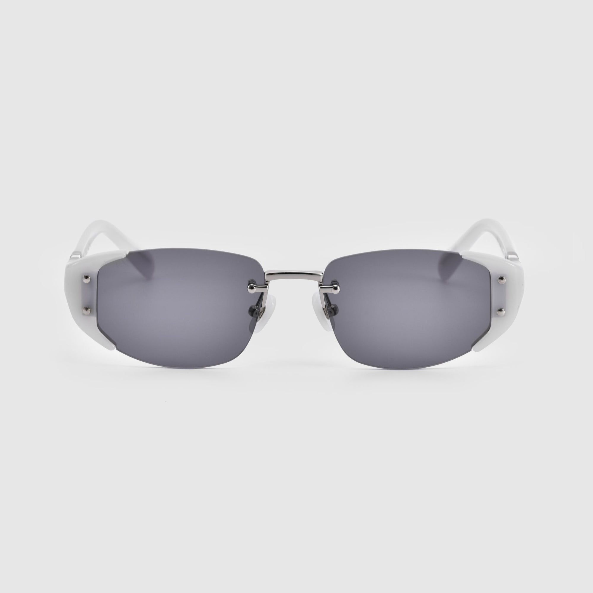 A pair of For Art's Sake® Harbour sunglasses with a retro-inspired design, featuring rectangular, dark-tinted lenses and a sleek frameless look. The temples are white with a metallic bar connecting the lenses at the nose bridge, complemented by jade-stone nose pads. The sunglasses are set against a plain white background.