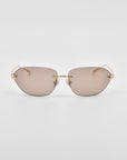 A pair of stylish For Art's Sake® Serpent I sunglasses with gold frames and brown-tinted, rimless lenses set against a white background. The sunglasses have a minimalist design, featuring 18-karat gold plating on the temples and a thin gold bridge across the nose. Natural jade-stone nose pads complete the luxurious look.