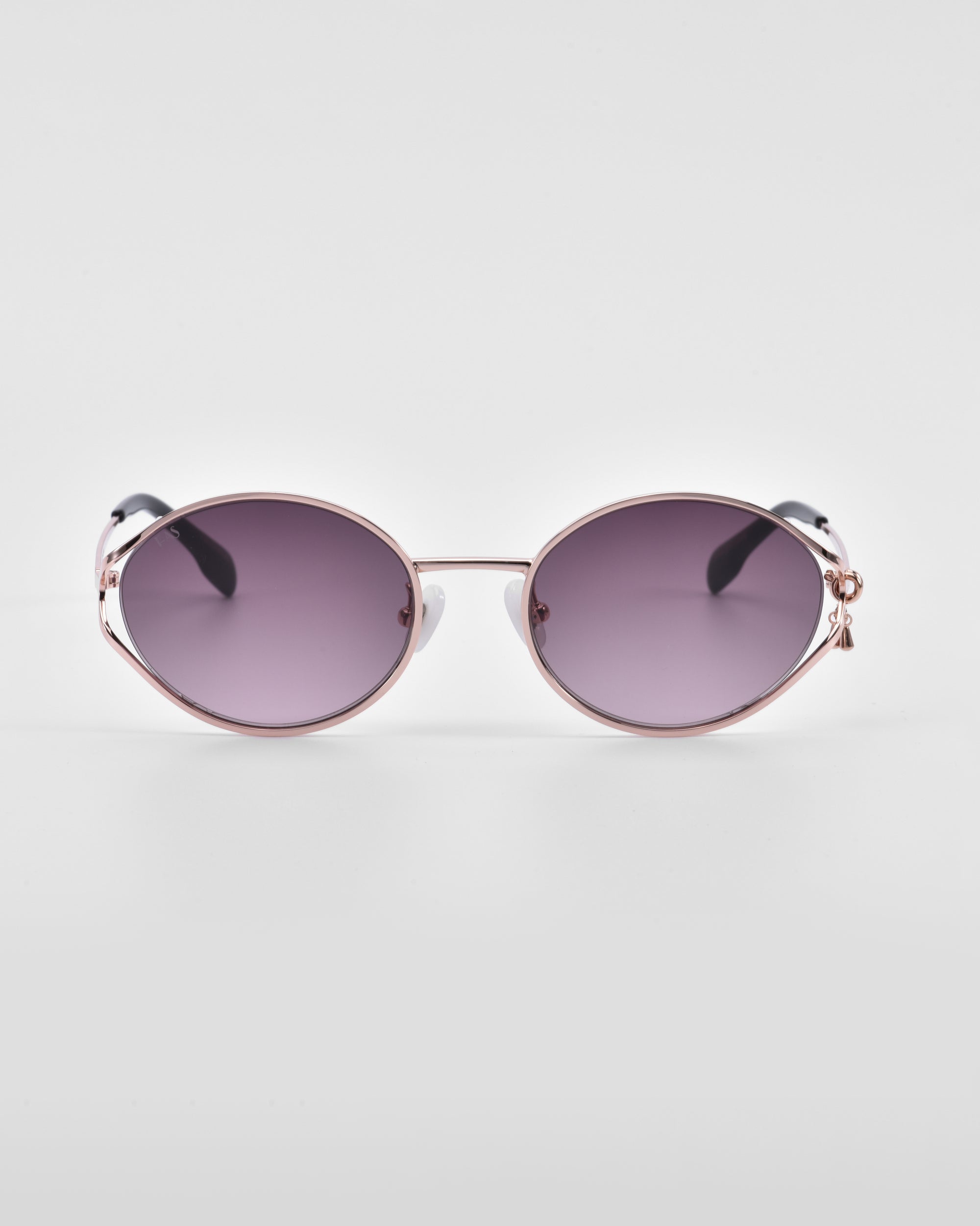 A pair of &#39;Sky&#39; sunglasses from For Art&#39;s Sake® with dark lenses and thin metallic frames. The arms are also metallic with black tips, and the nose pads are crafted from natural jade-stone. The background is plain white.