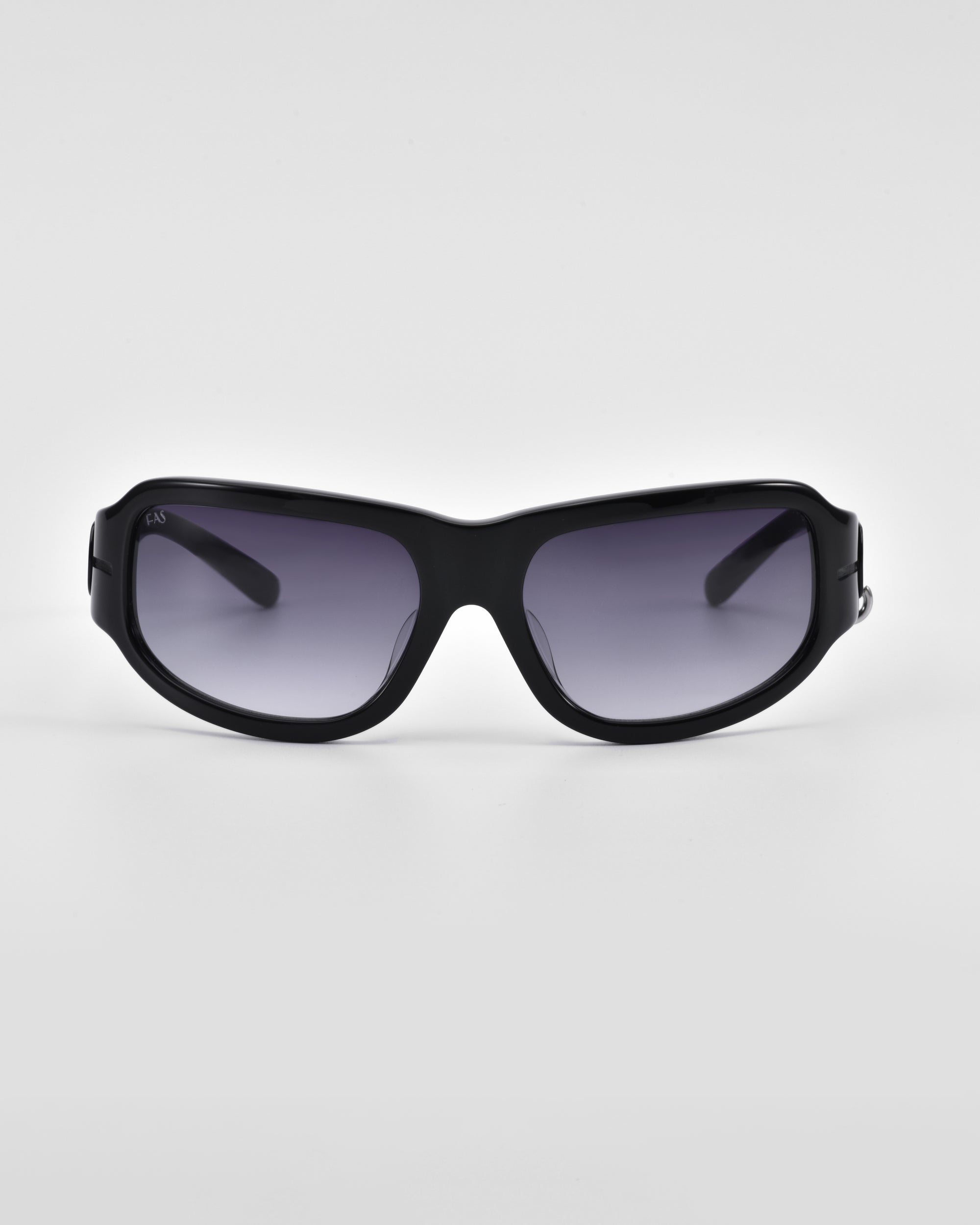 A pair of black For Art's Sake® Raven sunglasses with dark tinted lenses is centered against a plain white background. The frames are slightly curved with a sleek design, and the temples are thick and straight, reminiscent of the Y2K wrap sunglasses trend.