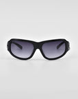 A pair of black For Art's Sake® Raven sunglasses with dark tinted lenses is centered against a plain white background. The frames are slightly curved with a sleek design, and the temples are thick and straight, reminiscent of the Y2K wrap sunglasses trend.