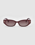 A pair of For Art's Sake® Skinny Latte sunglasses with dark burgundy rectangular frames featuring small gold accents and dark tinted lenses, crafted from biodegradable acetate, set against a white background.