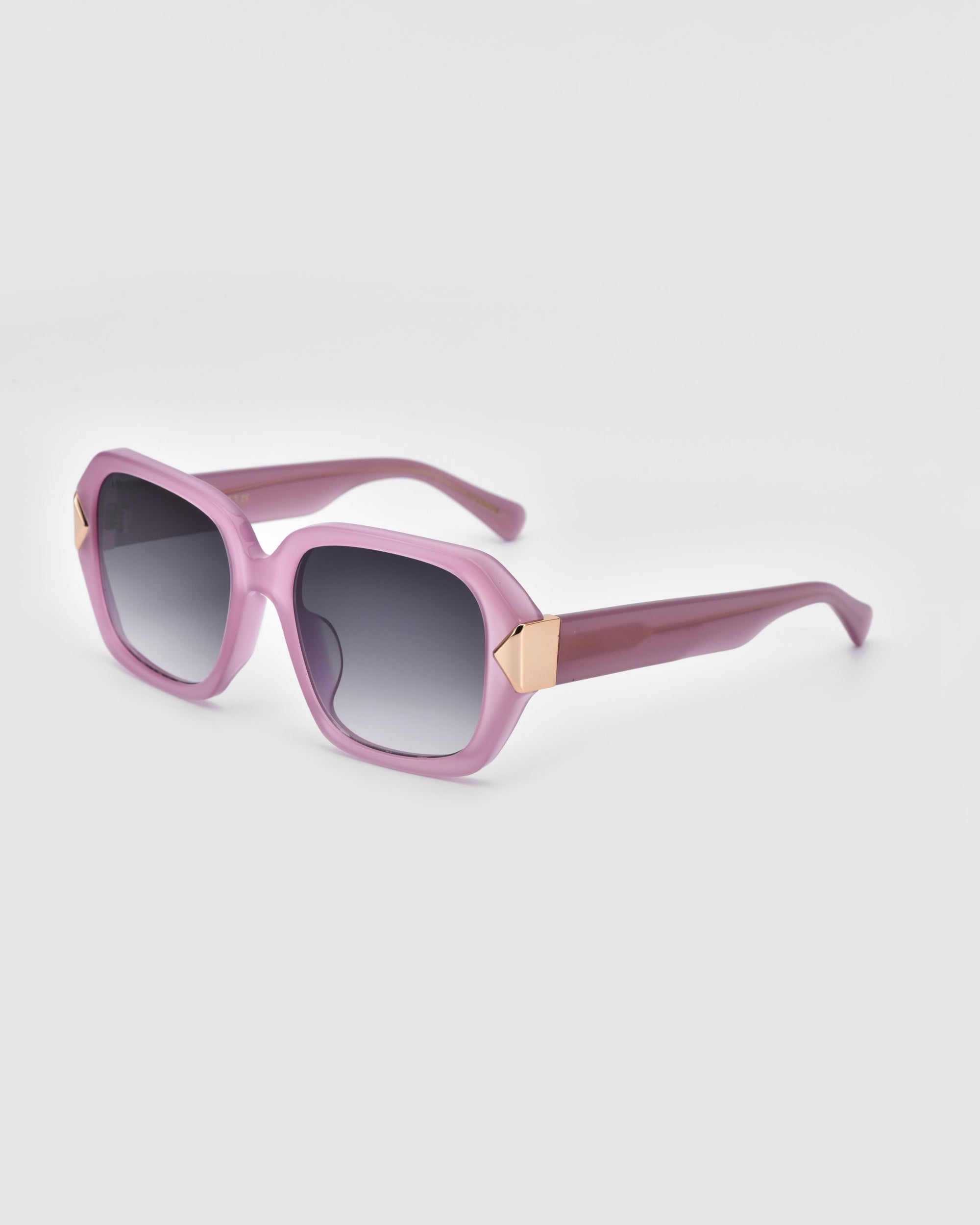 Discover Frankie by For Art's Sake®: a pair of stylish rectangular sunglasses featuring trendy pink chunky acetate frames and dark gradient lenses. The temple arms are adorned with gold accents near the hinges, adding an element of elegance to the design. Set against a plain background, these sunglasses truly stand out.