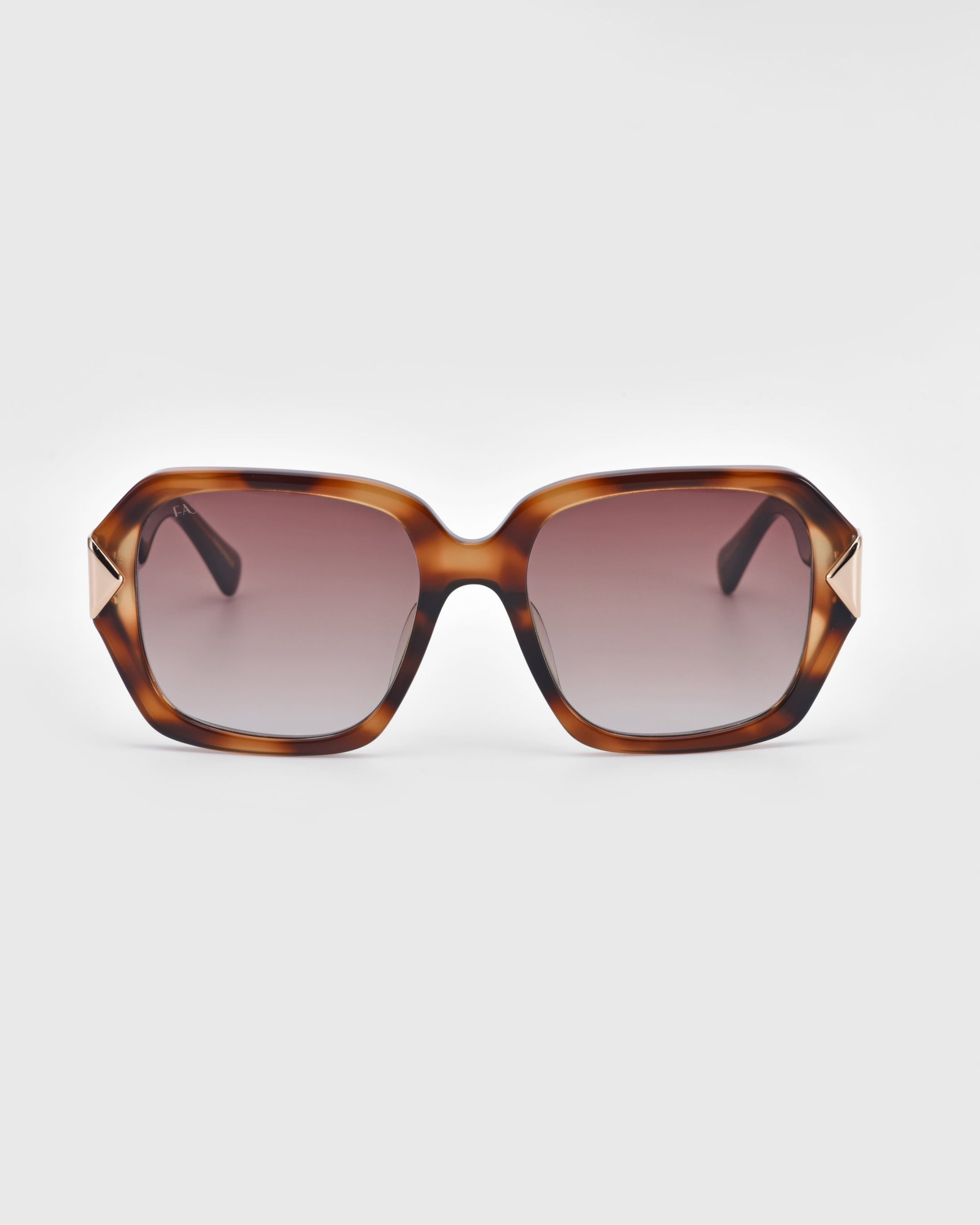 A pair of For Art's Sake® Frankie sunglasses featuring a tortoiseshell frame with square gradient lenses, darkening from the top and lightening towards the bottom. The arms are black with gold accents near the hinges, showcasing modern boldness against a white background.