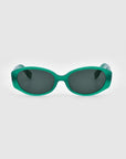 A pair of green, oval-shaped For Art's Sake® Friday sunglasses with dark-tinted lenses are displayed against a plain white background, offering chic geometric eyewear with premium UV protection.