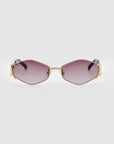 A pair of luxury Empress sunglasses by For Art's Sake® with geometric, gold frames and dark gradient lenses. These sunglasses feature unique angles, UV protection, and a sleek, modern look.