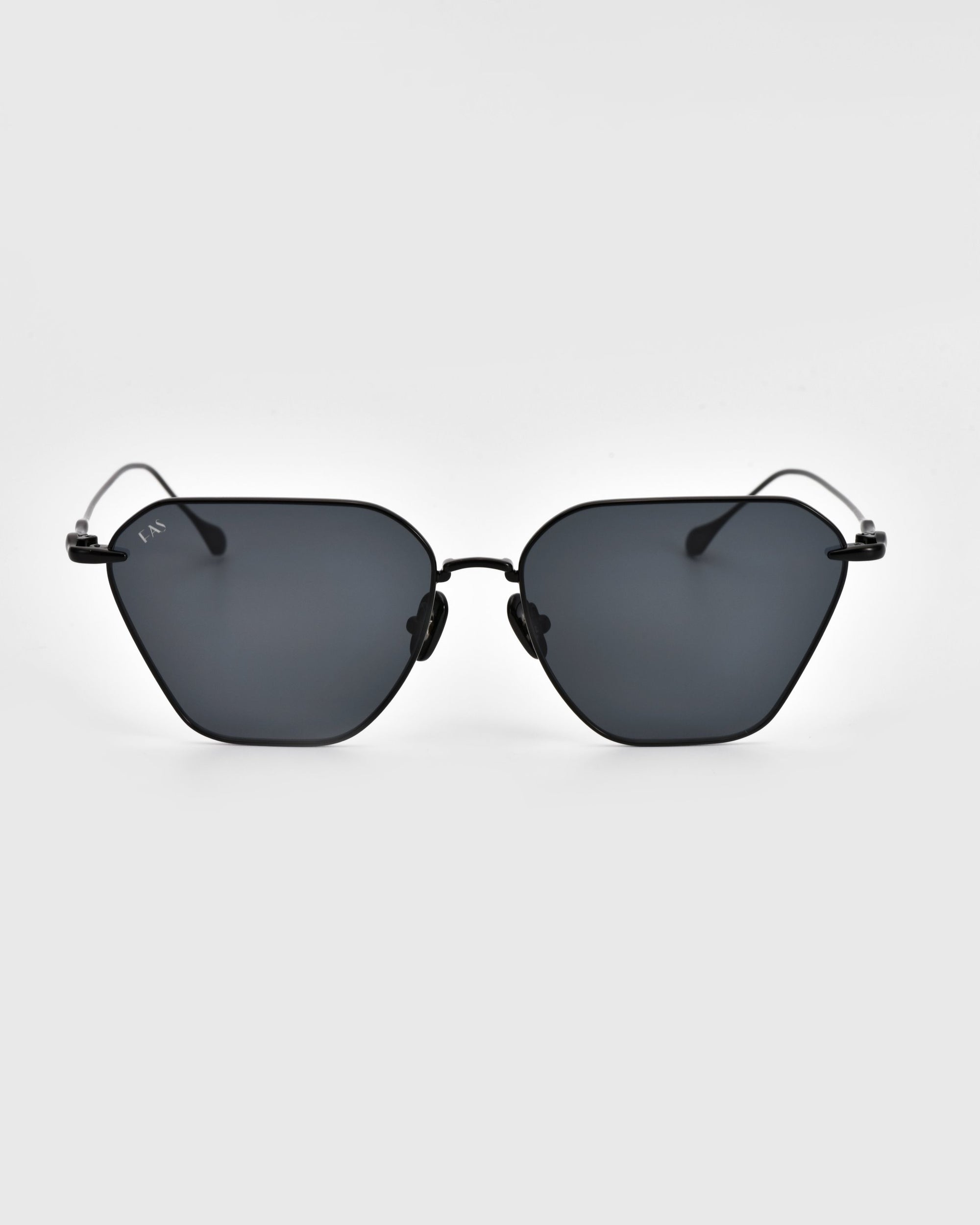 A pair of modern Cece Sunglasses from For Art&#39;s Sake® featuring gradient lenses and a thin black metal frame. The lenses have a slightly angular geometric shape, and the frame boasts a minimalist design with sleek, thin temples. The white background contrasts beautifully with the sunglasses, accentuating their design.