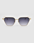 Introducing the Cece Sunglasses by For Art's Sake®: a pair of fashionable sunglasses boasting a sophisticated gold-colored frame and distinct hexagonal lenses. These stylish accessories feature gradient lenses that transition smoothly from dark at the top to lighter towards the bottom, all showcased elegantly against a plain white background.