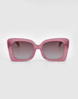 A pair of oversized, square-shaped Ribbon Sunglasses by For Art's Sake®, featuring pink frames and dark gradient lenses, set against a plain white background.