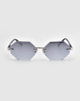 The Haze octagonal sunglasses from For Art's Sake®'s Rose Garden collection, featuring light gray lenses and thin metal arms, are showcased against a plain white background.