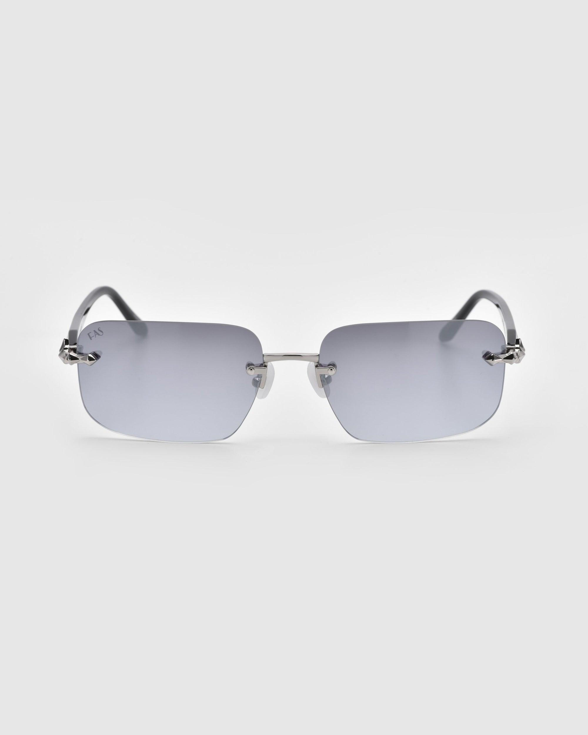 Edith sunglasses from For Art's Sake® feature rectangular rimless design, grey-tinted lenses, and thin metal arms against a plain white background. Part of the elegant Rose Garden collection.