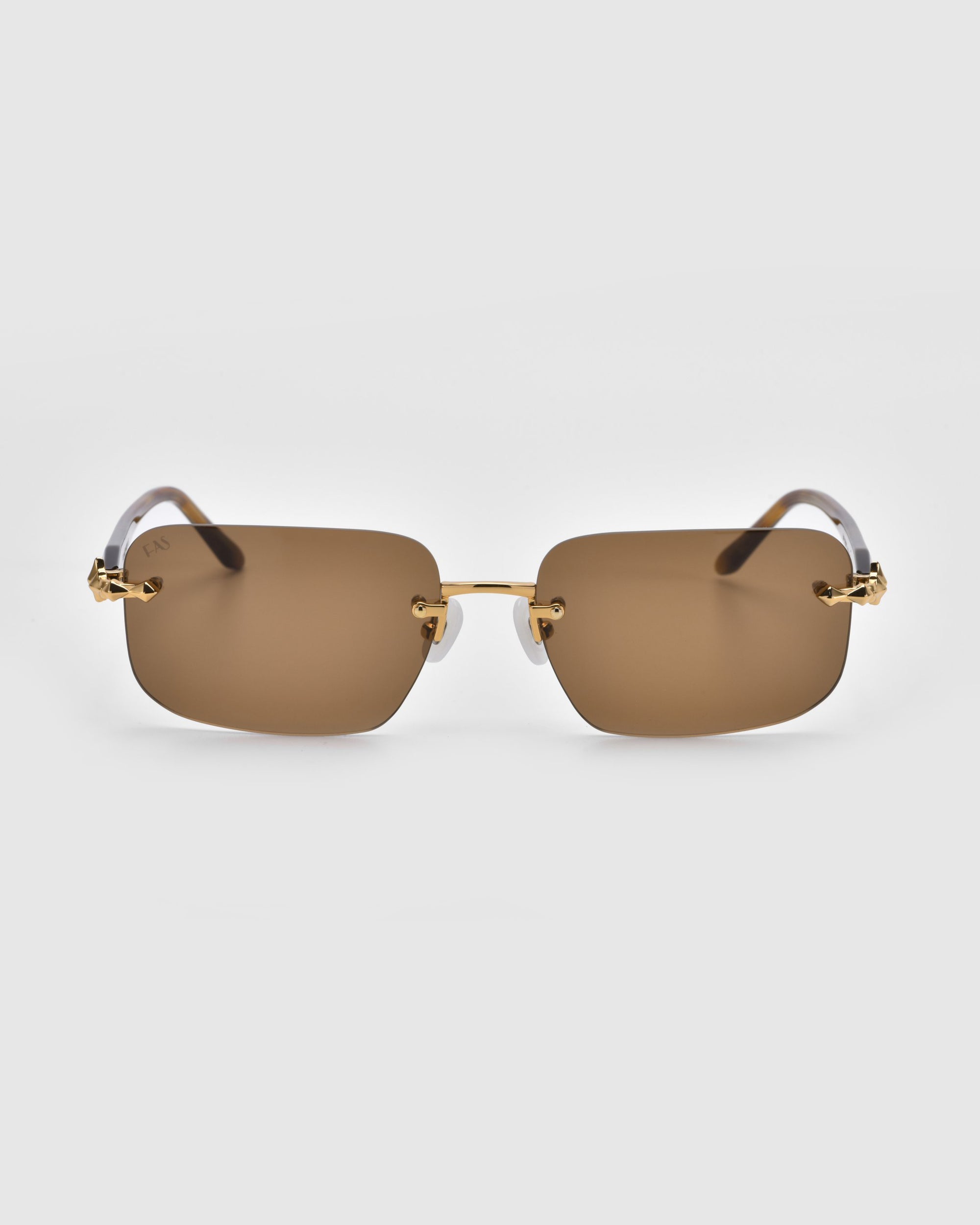 Part of For Art's Sake® Rose Garden collection, the Edith sunglasses feature brown-tinted rectangular lenses with gold-tone arms against a white backdrop.