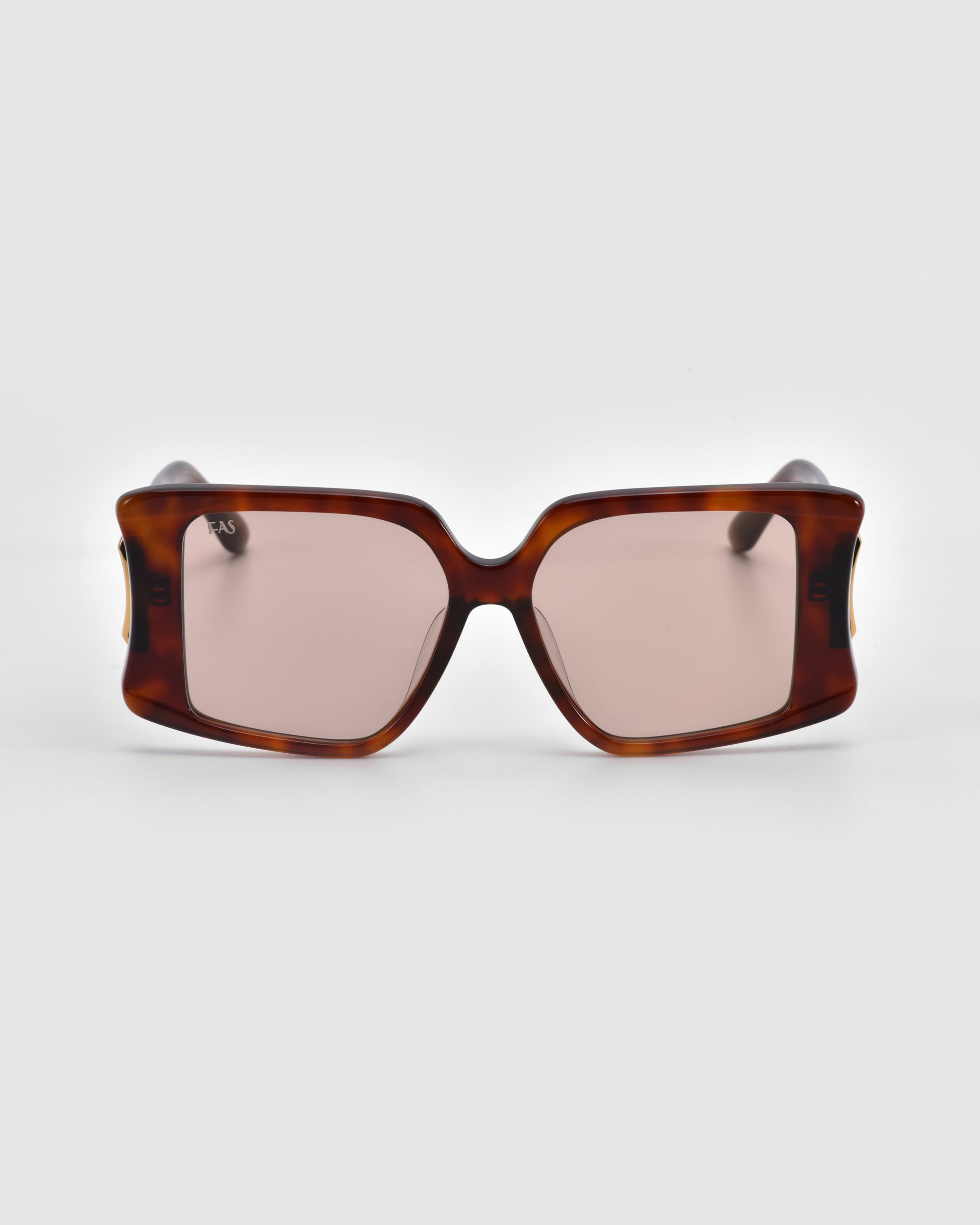 The Bloom sunglasses by For Art's Sake® feature an oversized acetate tortoise shell design with large, rectangular frames and brown-tinted lenses, making a bold statement against a plain white background.