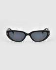 The Lush sunglasses by For Art's Sake® feature sleek black frames and premium dark lenses. Their arms showcase small gold anchor accents, exuding luxury against a light gray background.