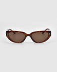 The Lush sunglasses by For Art's Sake® feature tortoiseshell curved rectangular frames and brown lenses, crafted from premium materials. Displayed on a white background, each temple is accented with a small metallic decoration.