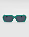 Fleur sunglasses by For Art's Sake® feature green square frames, dark lenses, and subtle gold accents on the acetate arms, showcased against a plain light background.