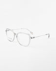 A pair of clear, square-framed eyeglasses with thin temples and a minimalist design set against a plain white background. The Sonnet by For Art's Sake® appear modern and lightweight, showcasing a streamlined and elegant aesthetic.