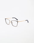 A pair of stylish For Art's Sake® Windsor eyeglasses with thin 18-karat gold-plated frames and black temple tips are set against a plain white background. The lenses, which feature a blue light filter, showcase the minimalist and elegant design of the eyewear.