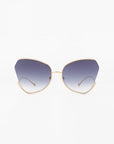 A pair of stylish For Art's Sake® Watercolour sunglasses with large, ombré lenses that fade from dark at the top to light at the bottom. The frame is thin and gold-plated stainless steel, featuring a unique butterfly silhouette that gives it a fashionable, modern look.