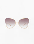 A pair of fashionable Watercolour sunglasses by For Art's Sake® with large, ombré lenses and thin, gold-plated stainless steel frames. The subtle cat-eye shape adds a stylish and retro flair to the design, while the butterfly silhouette brings an extra touch of elegance against a plain white background.