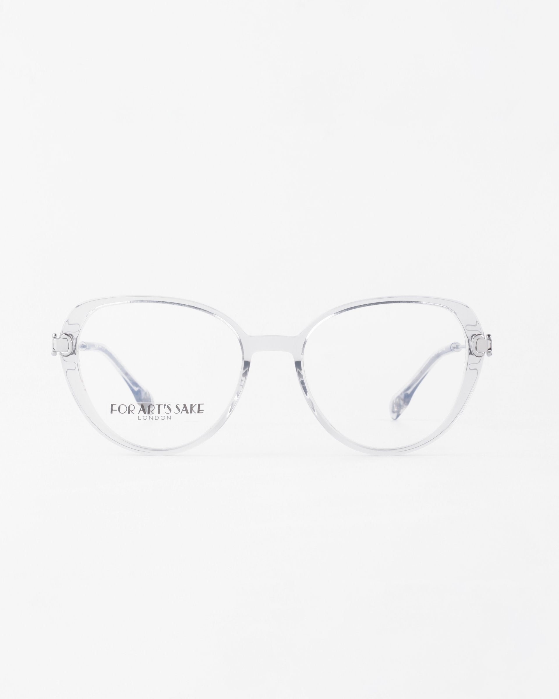 A pair of clear-frame eyeglasses with round lenses is positioned against a white background. The words &quot;FOR ARTS SAKE&quot; and &quot;LONDON&quot; are printed in small font on one of the lenses. These stylish Waterhouse frames by For Art&#39;s Sake® can be fitted with prescription lenses for optimal vision correction.