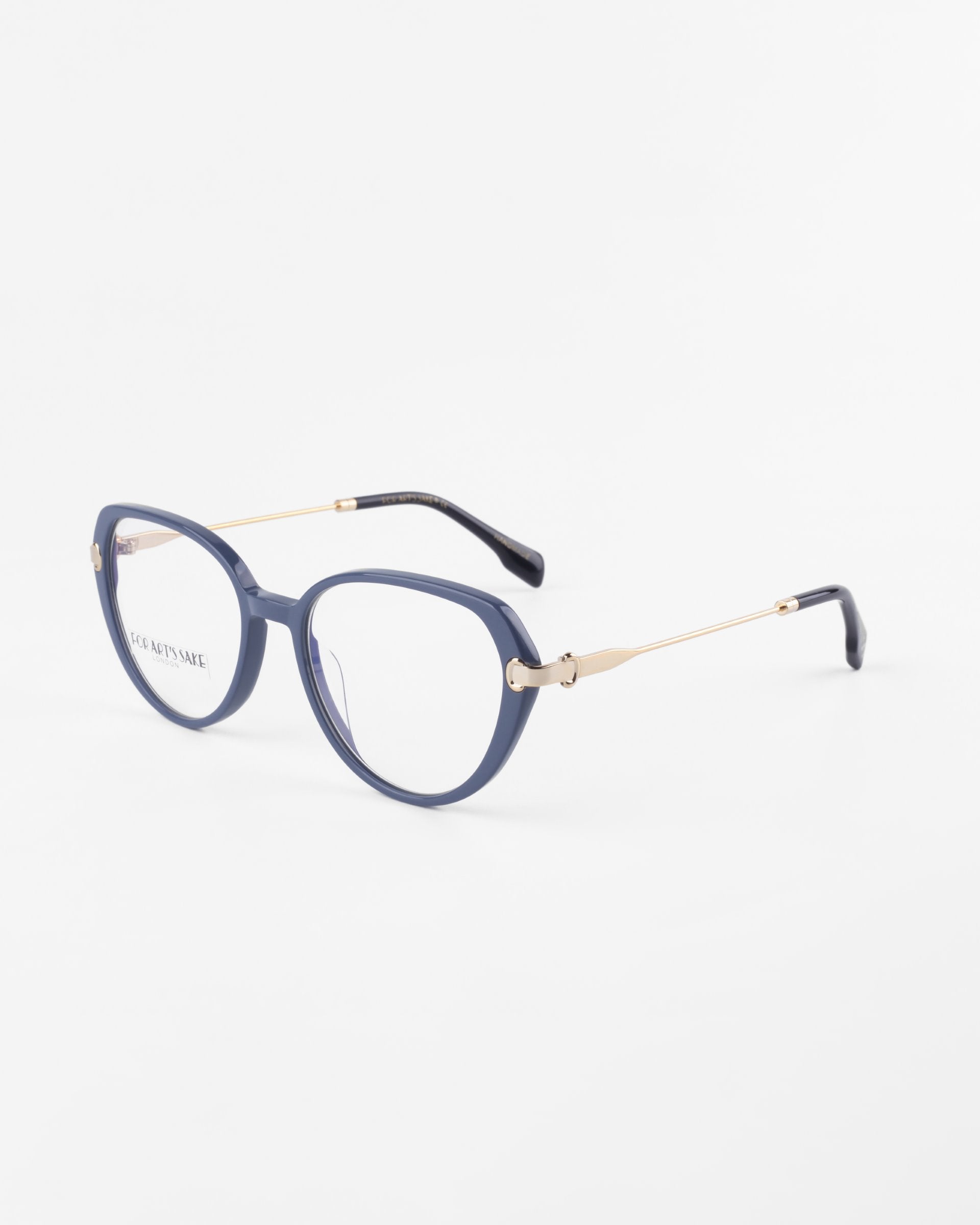 A pair of Waterhouse eyeglasses by For Art's Sake® with rounded grayish-blue frames, thin 18-karat gold-plated temples, and black ear tips. The glasses have clear prescription lenses and are positioned on a white background.