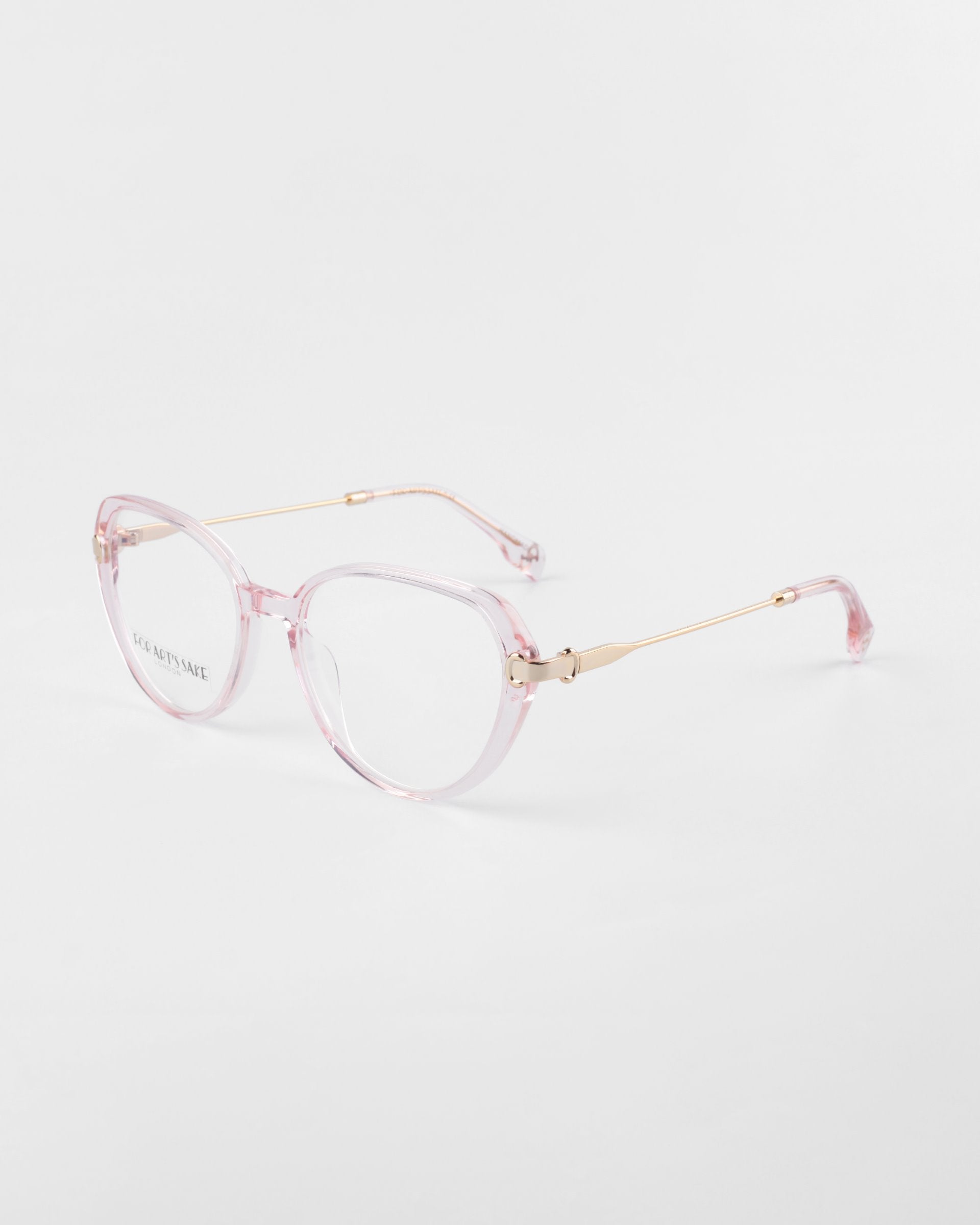 A pair of fashionable eyeglasses with light pink-colored, transparent rectangular frames and thin 18-karat gold-plated metal temples. The brand name &quot;For Art&#39;s Sake®&quot; is printed on the left lens. For modern users, the prescription lenses include a blue light filter. The glasses are set against a plain white background.

Product Name: Waterhouse