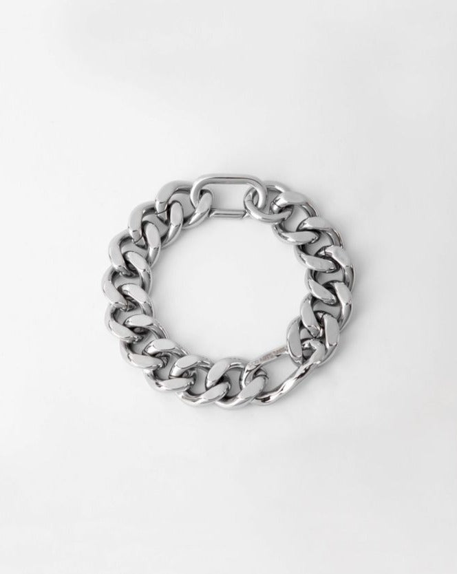 A For Art's Sake® Wave Bracelet with large, interlocking links is displayed against a plain white background. The design is bold and reflects light, giving it a polished appearance, making it the perfect statement piece.