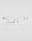 A pair of clear eyeglasses with transparent frames and a hint of a cat-eye silhouette rest on a white surface. The lenses have the text "For Art's Sake® Helene" printed on the left side. The design is minimalist and modern, with slightly thick frames and a subtle, elegant appearance.