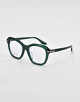 A pair of stylish green rectangular eyeglasses with a glossy finish, featuring 18-karat gold plating near the hinges. The For Art's Sake® Helene frames are sturdy with a slight curve in the arms, while the clear lenses rest on a plain white background.