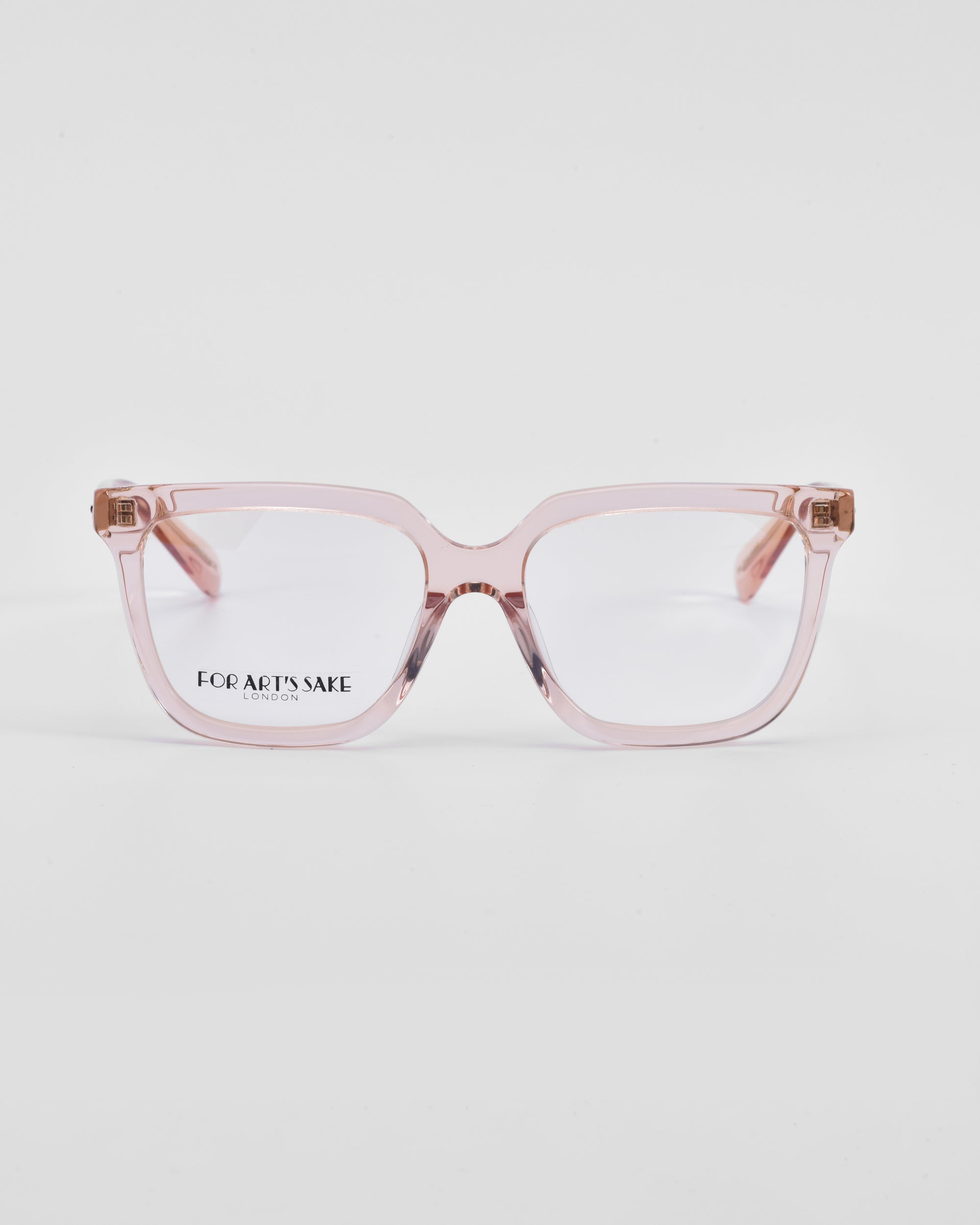 A pair of pink, square-framed eyeglasses with clear lenses and a classic square silhouette. The brand name &quot;For Art&#39;s Sake®&quot; is visible on the left lens. The background is plain white. Product Name: Nina