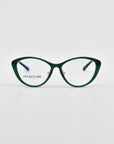 A pair of stylish green cat-eye eyeglasses with blue temples and jade-stone nose pads. The lenses are clear, and the words "For Art's Sake®" are printed on the left lens. These Perla II eyeglasses boast an optical design finesse and are set against a plain white background.