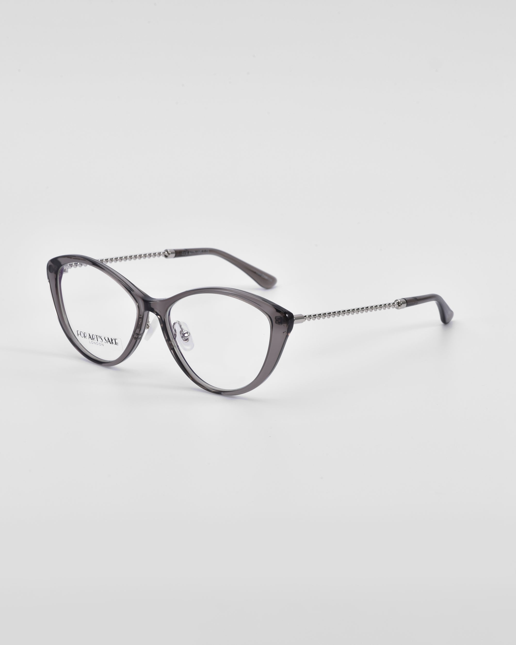 A pair of stylish Perla II eyeglasses by For Art&#39;s Sake® with a sleek black frame and a chain-like textured pattern on the temples. The lenses are clear, and the glasses feature jade-stone nose pads for added comfort. They are set against a plain white background.