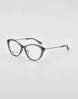 A pair of stylish Perla II eyeglasses by For Art's Sake® with a sleek black frame and a chain-like textured pattern on the temples. The lenses are clear, and the glasses feature jade-stone nose pads for added comfort. They are set against a plain white background.